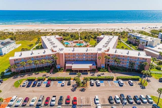 bird's eye view featuring a water view and a view of the beach