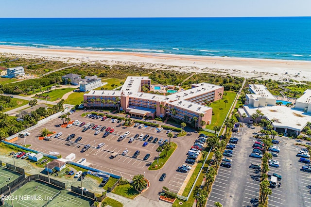 bird's eye view with a water view and a view of the beach