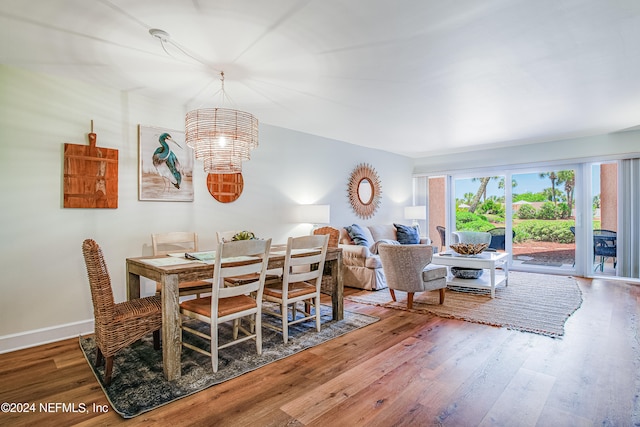 dining area with a notable chandelier and wood-type flooring