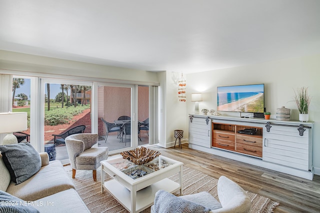 4 Ocean Trace Rd Unit 102, Saint Augustine, FL 32080 - living area featuring light wood-type flooring and baseboards