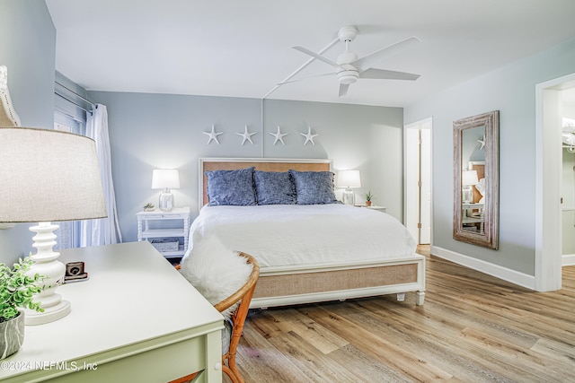 bedroom with light hardwood / wood-style flooring and ceiling fan