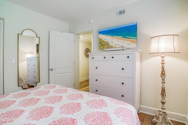 bedroom featuring hardwood / wood-style flooring