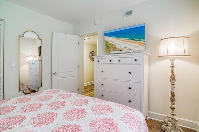 4 Ocean Trace Rd Unit 102, Saint Augustine, FL 32080 - bedroom featuring wood finished floors, visible vents, and baseboards