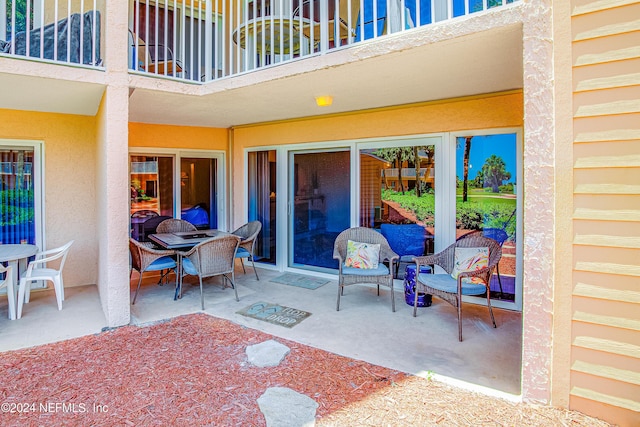 4 Ocean Trace Rd Unit 102, Saint Augustine, FL 32080 - view of patio featuring a balcony