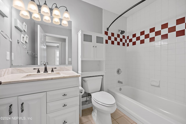 full bathroom featuring vanity, toilet, tile patterned flooring, and tiled shower / bath