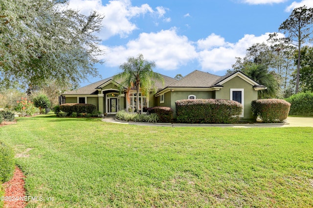 ranch-style house with a front lawn