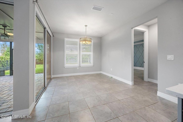 empty room with light tile patterned floors