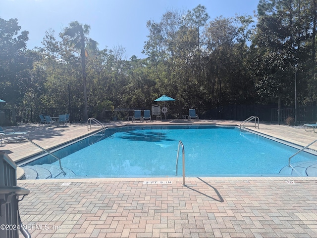 view of pool with a patio area