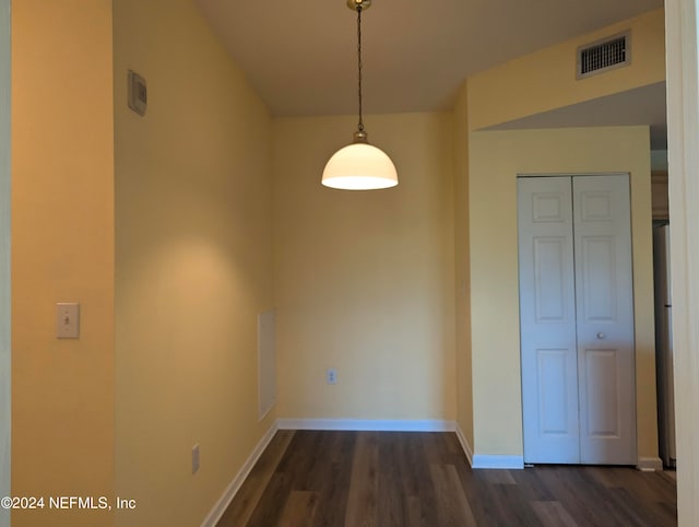 unfurnished dining area with dark hardwood / wood-style floors