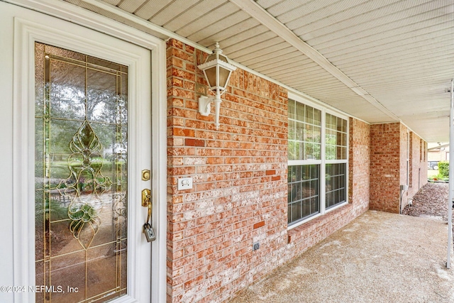 doorway to property featuring covered porch