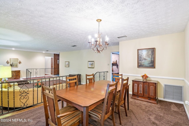 dining space with carpet flooring, a notable chandelier, and a textured ceiling