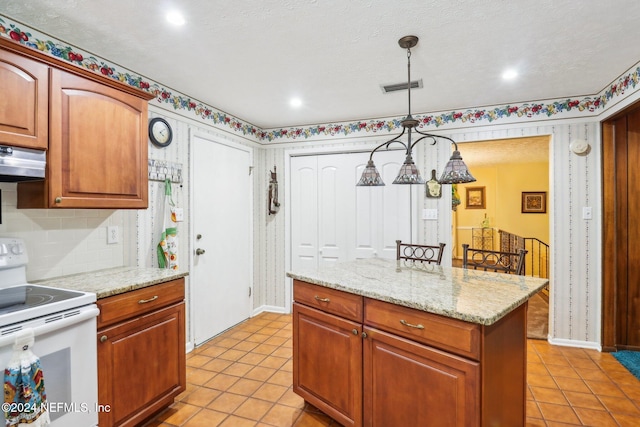 kitchen with light stone counters, light tile patterned flooring, white electric range oven, a kitchen island, and hanging light fixtures