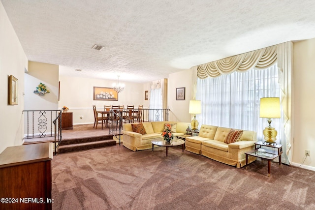 living room featuring carpet flooring and a textured ceiling