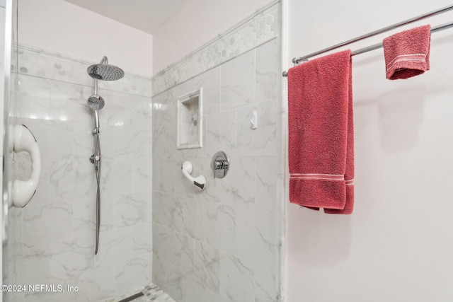 bathroom with a tile shower