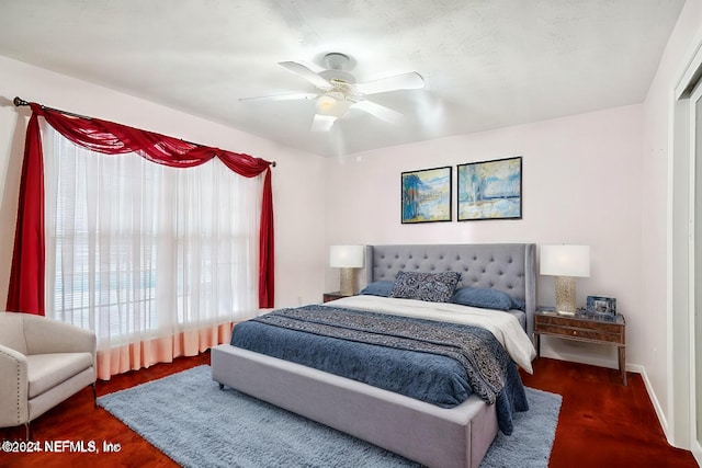 bedroom featuring dark wood-type flooring and ceiling fan