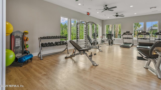 gym with recessed lighting, baseboards, and light wood finished floors