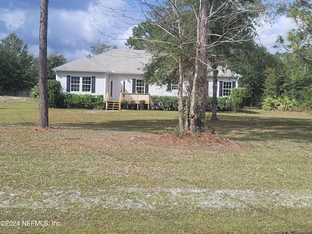 ranch-style house with a front lawn