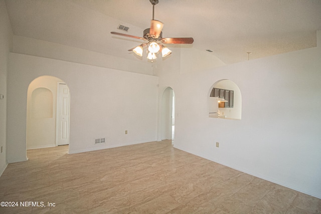 unfurnished room featuring vaulted ceiling and ceiling fan