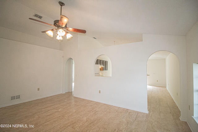 spare room with ceiling fan and vaulted ceiling