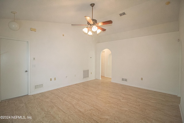 unfurnished room with lofted ceiling and ceiling fan