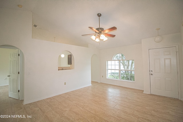 unfurnished living room featuring ceiling fan