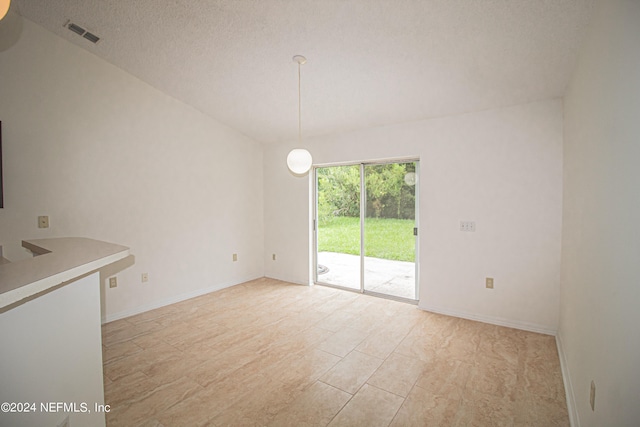 interior space with a textured ceiling