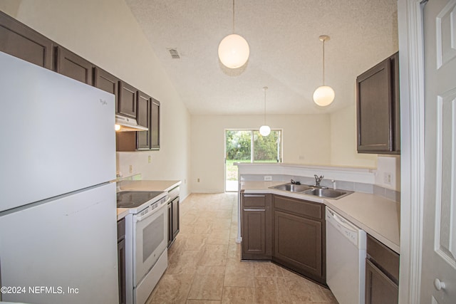 kitchen with lofted ceiling, sink, hanging light fixtures, and white appliances