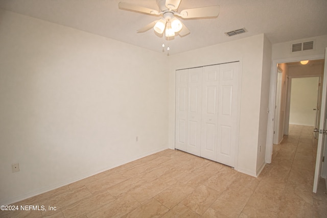 unfurnished bedroom featuring a closet and ceiling fan