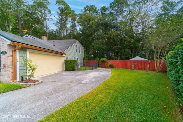 view of yard featuring a garage