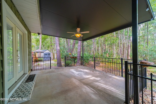 view of patio / terrace with a shed and ceiling fan