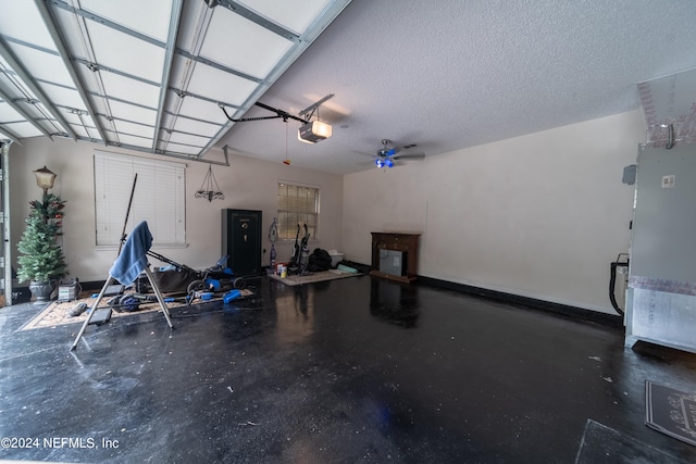 garage featuring a garage door opener and ceiling fan