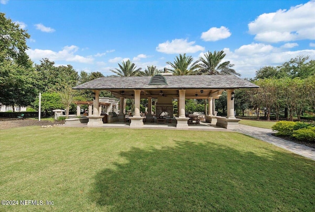 view of property's community with a gazebo and a yard