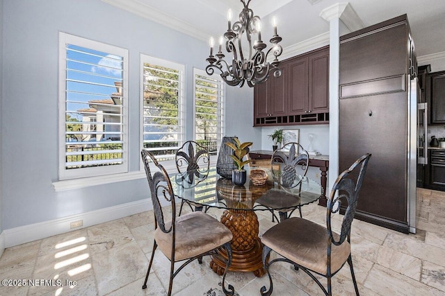 dining area featuring crown molding and a notable chandelier