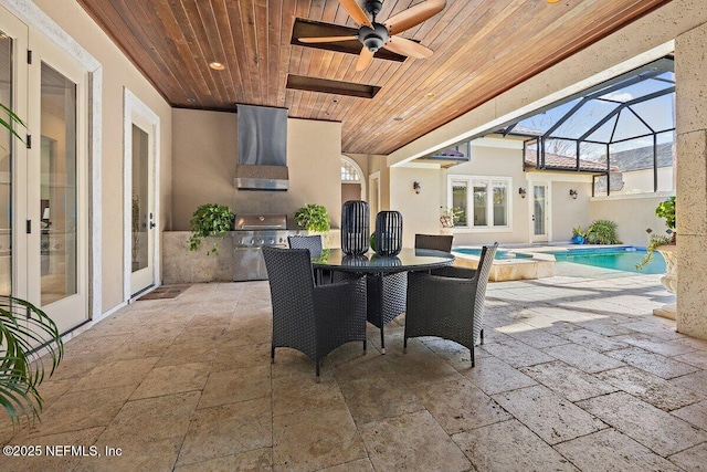 view of patio featuring ceiling fan, a pool with hot tub, and glass enclosure