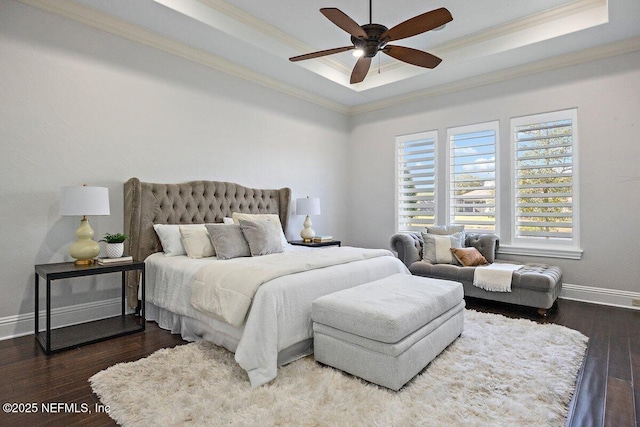 bedroom with a raised ceiling, ceiling fan, hardwood / wood-style floors, and crown molding