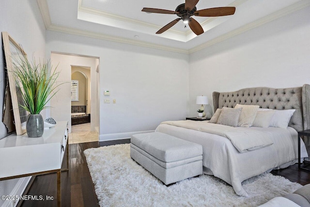 bedroom with dark hardwood / wood-style floors, a raised ceiling, ceiling fan, and crown molding