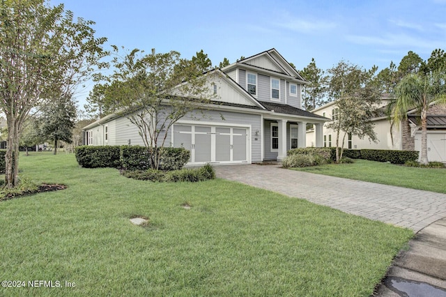 145 Sugar Sand Ln, Saint Johns, FL 32259 - craftsman-style home featuring board and batten siding, an attached garage, driveway, and a front yard