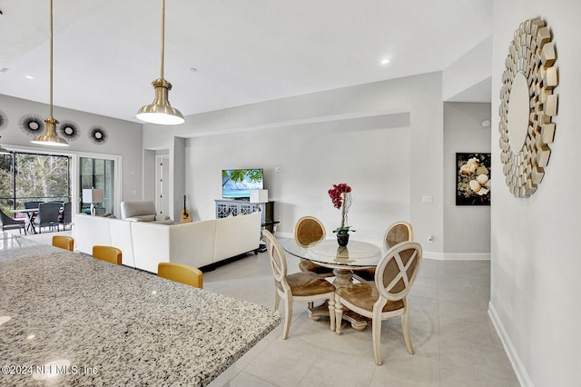 dining space featuring light tile patterned floors