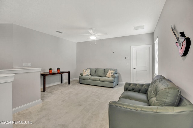 carpeted living room featuring ceiling fan