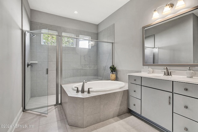 bathroom featuring vanity, tile patterned flooring, and plus walk in shower