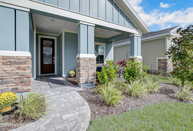 doorway to property featuring a porch