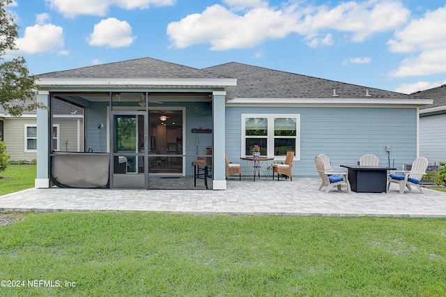 rear view of house with a patio and a lawn