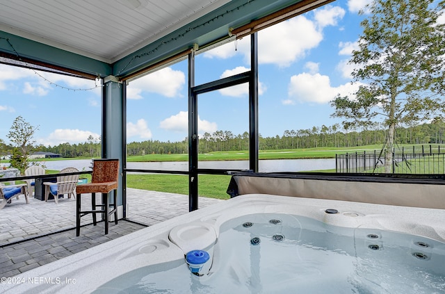 sunroom with a water view