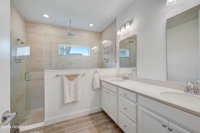 bathroom with vanity and walk in shower