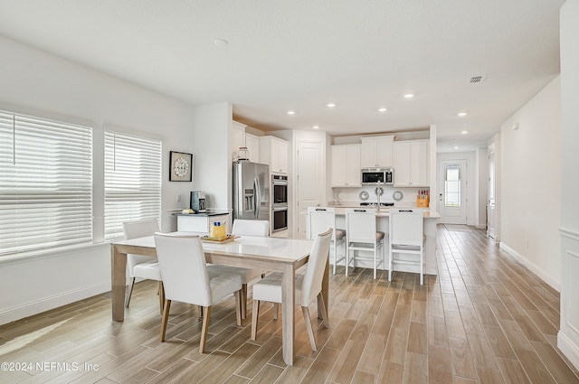 dining room featuring light wood-type flooring