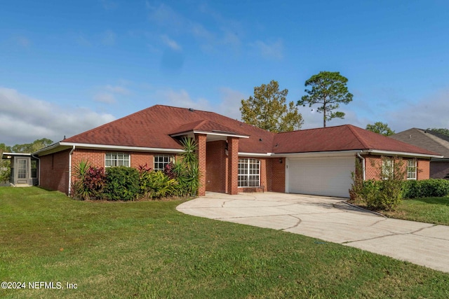 ranch-style home with a front yard and a garage