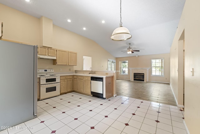 kitchen with lofted ceiling, light brown cabinets, light hardwood / wood-style flooring, hanging light fixtures, and white appliances