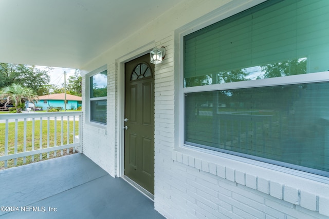 doorway to property with covered porch