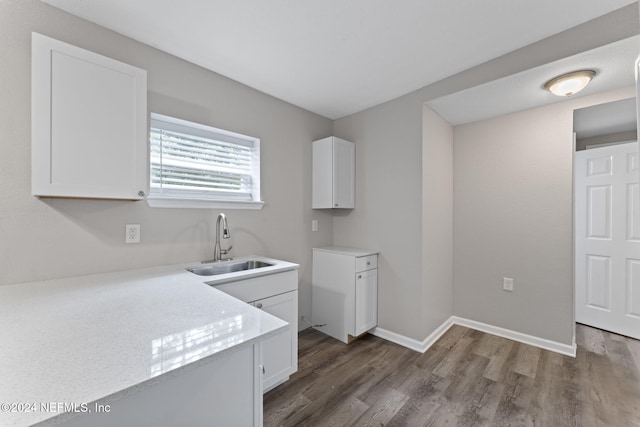 kitchen featuring sink, white cabinets, and dark hardwood / wood-style flooring