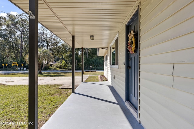 view of patio featuring a porch